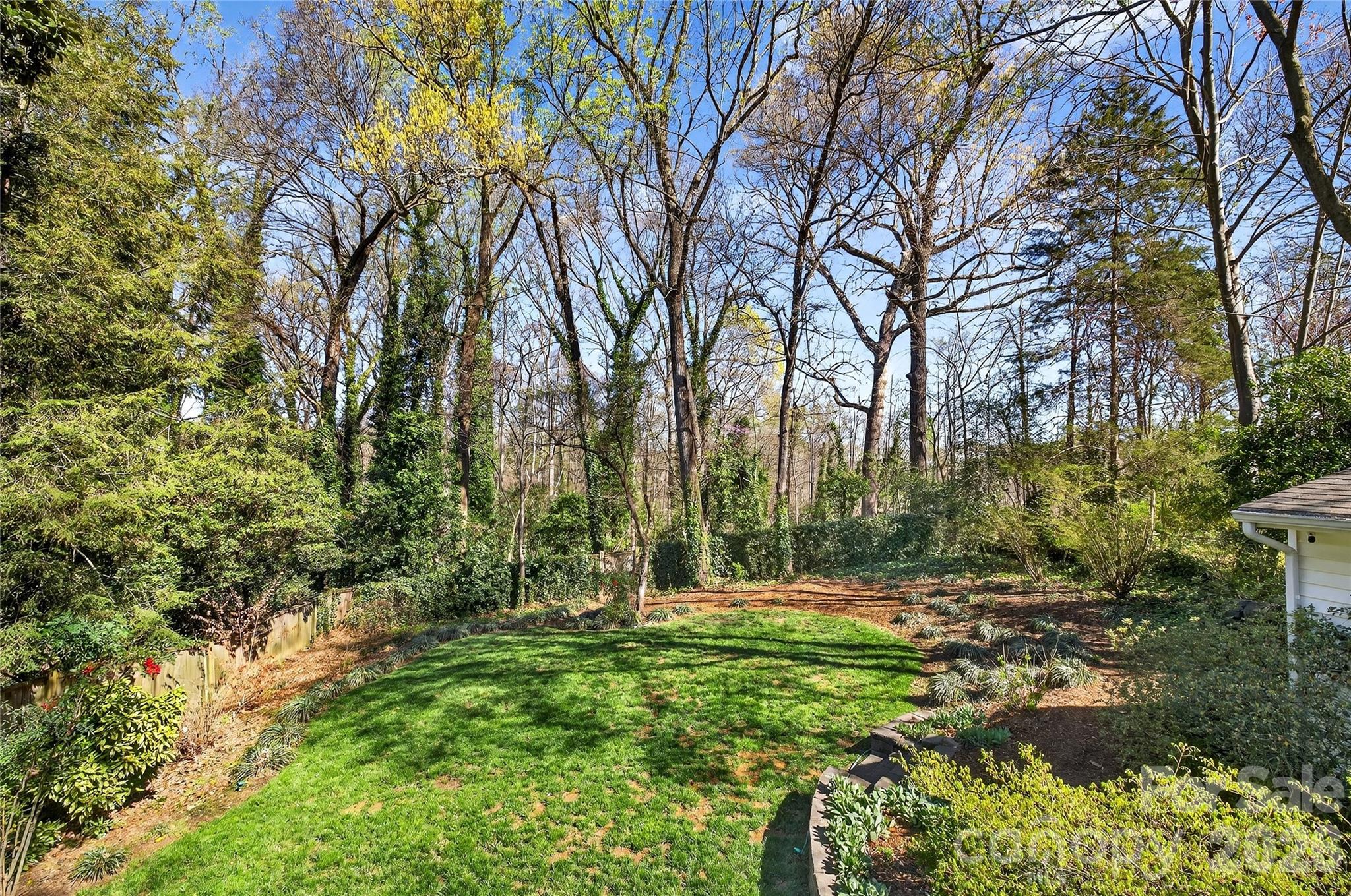 3717 Riverbend Road Charlotte, NC 28210 - Photo 36 of 41 a backyard of a house with lots of green space