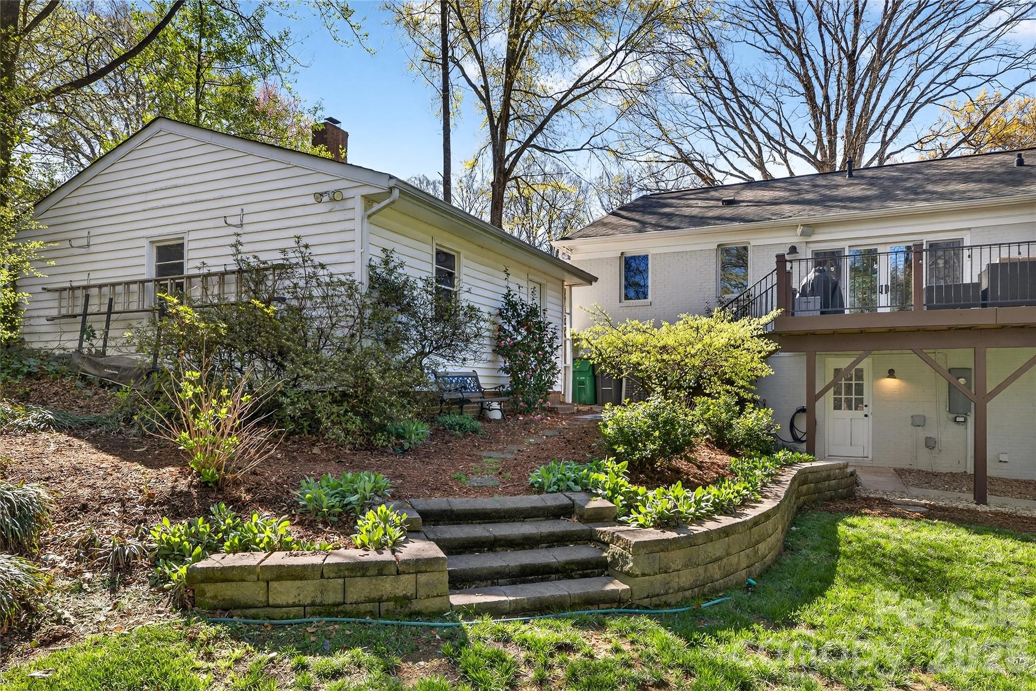 3717 Riverbend Road Charlotte, NC 28210 - Photo 39 of 41 a front view of a house with a garden