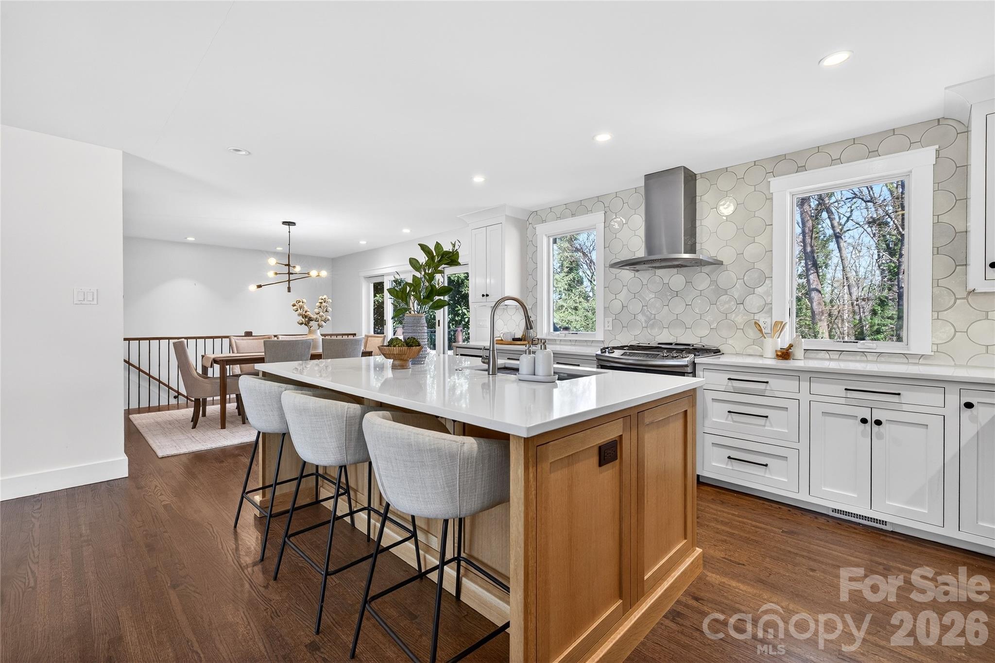 3717 Riverbend Road Charlotte, NC 28210 - Photo 5 of 41 a kitchen with white cabinets and sink