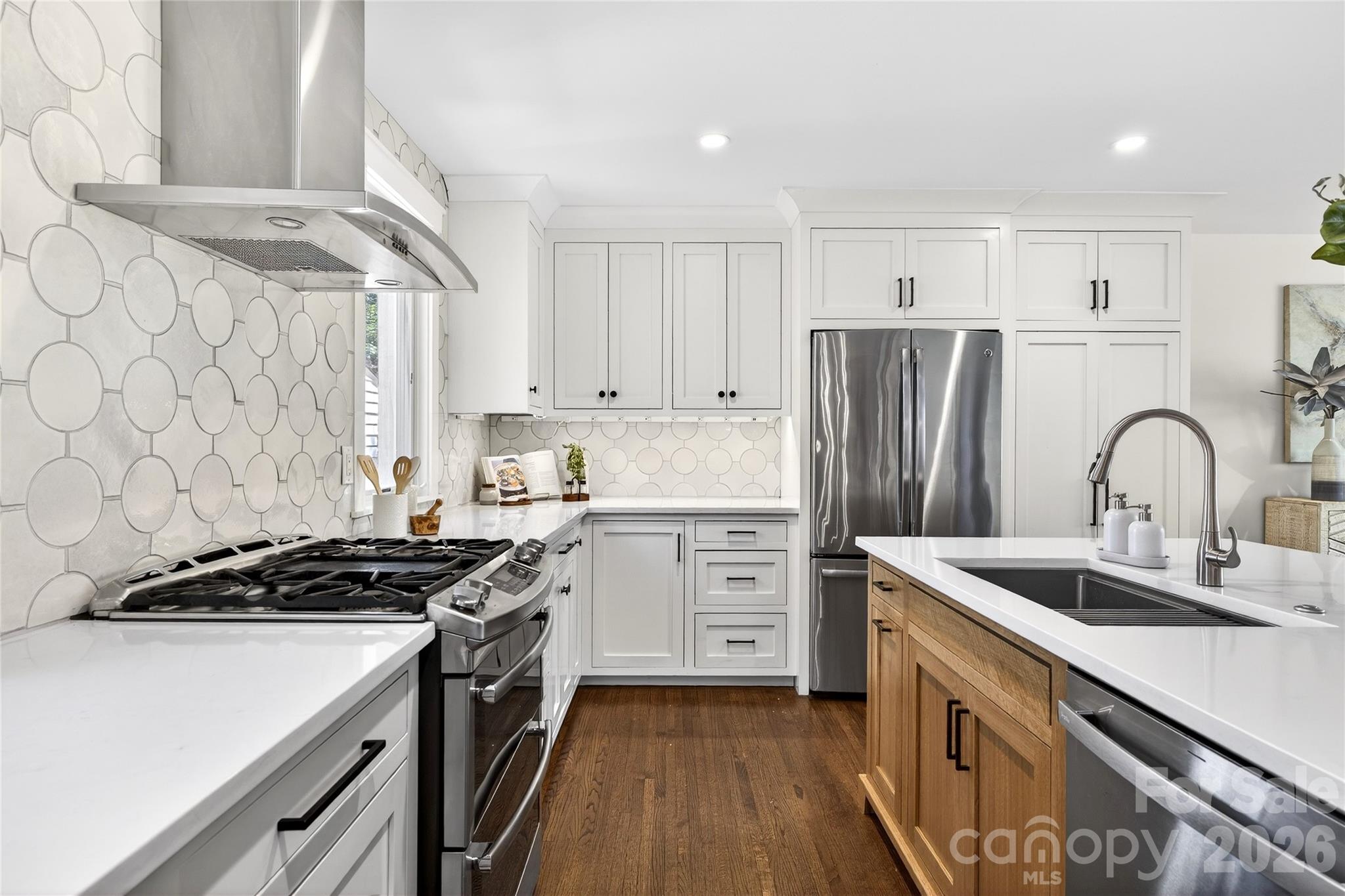 3717 Riverbend Road Charlotte, NC 28210 - Photo 6 of 41 a kitchen with stainless steel appliances a sink stove and refrigerator