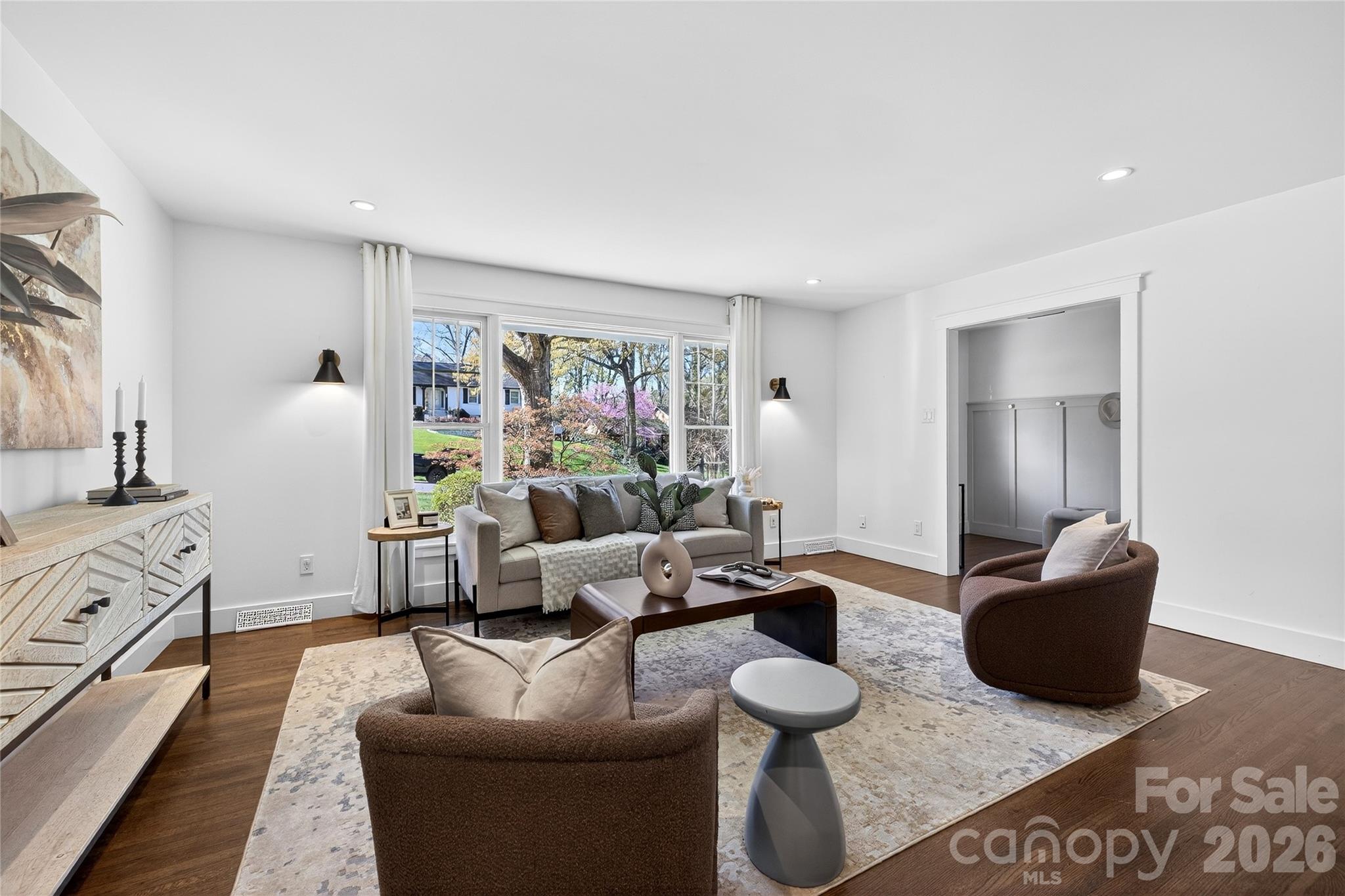 3717 Riverbend Road Charlotte, NC 28210 - Photo 8 of 41 a living room with furniture and a flat screen tv