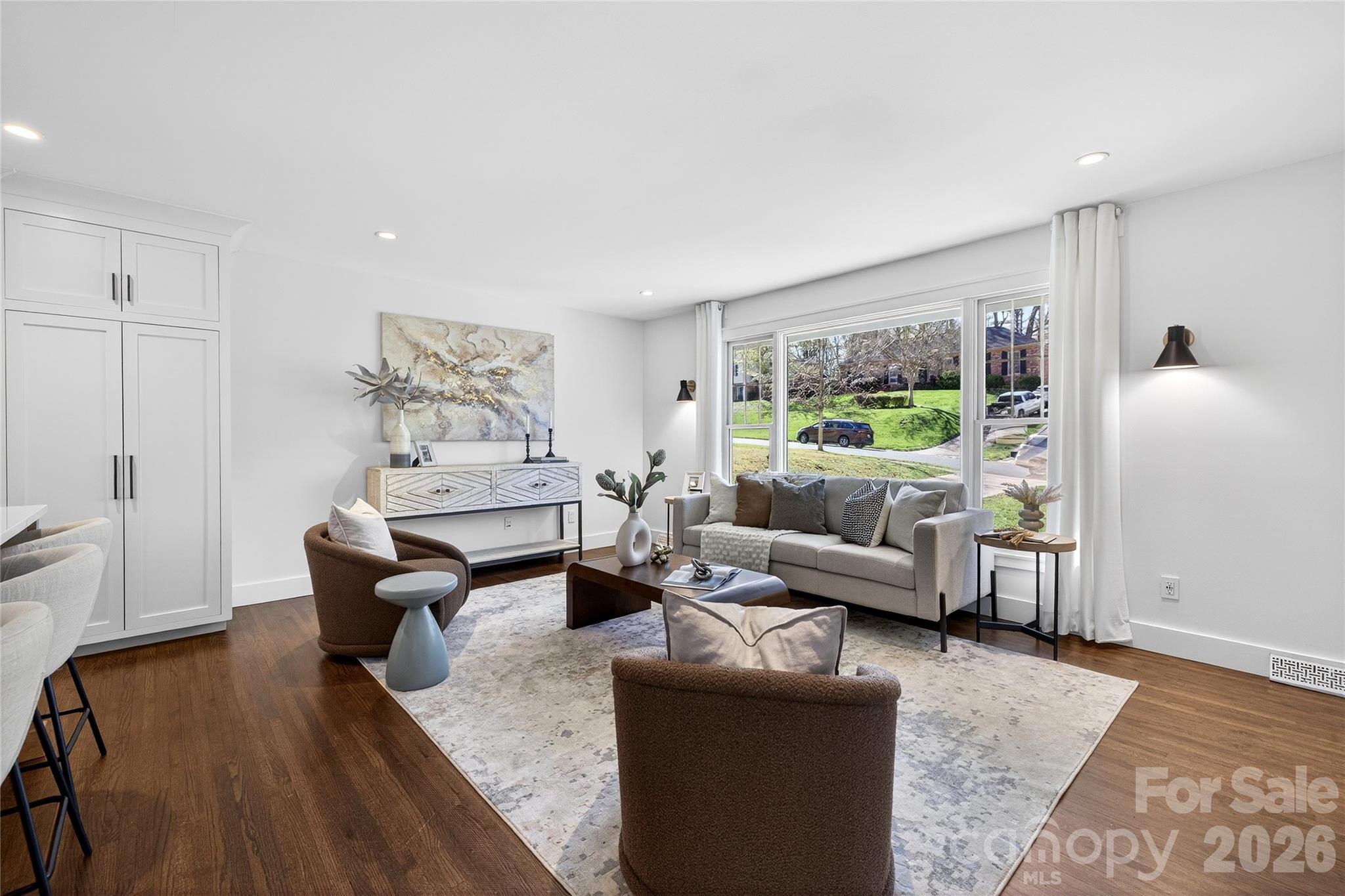 3717 Riverbend Road Charlotte, NC 28210 - Photo 10 of 41 a living room with furniture and a wooden floor
