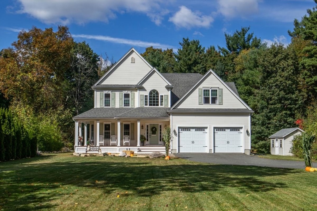 55 Cross Street Foxboro, MA 02035 - Photo 1 of 7 a front view of a house with a garden