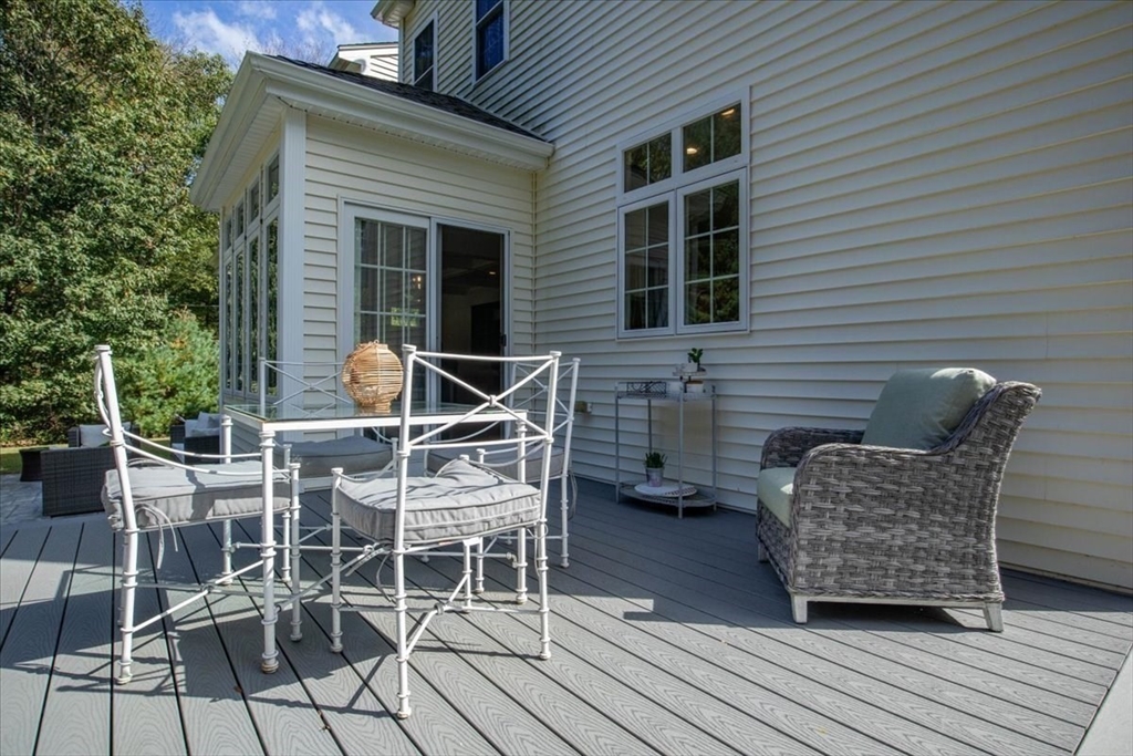 55 Cross Street Foxboro, MA 02035 - Photo 3 of 7 a patio with table and chairs