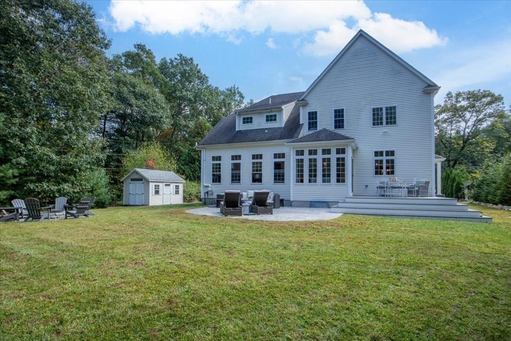 55 Cross Street Foxboro, MA 02035 - Photo 4 of 7 a view of a house with swimming pool and a yard