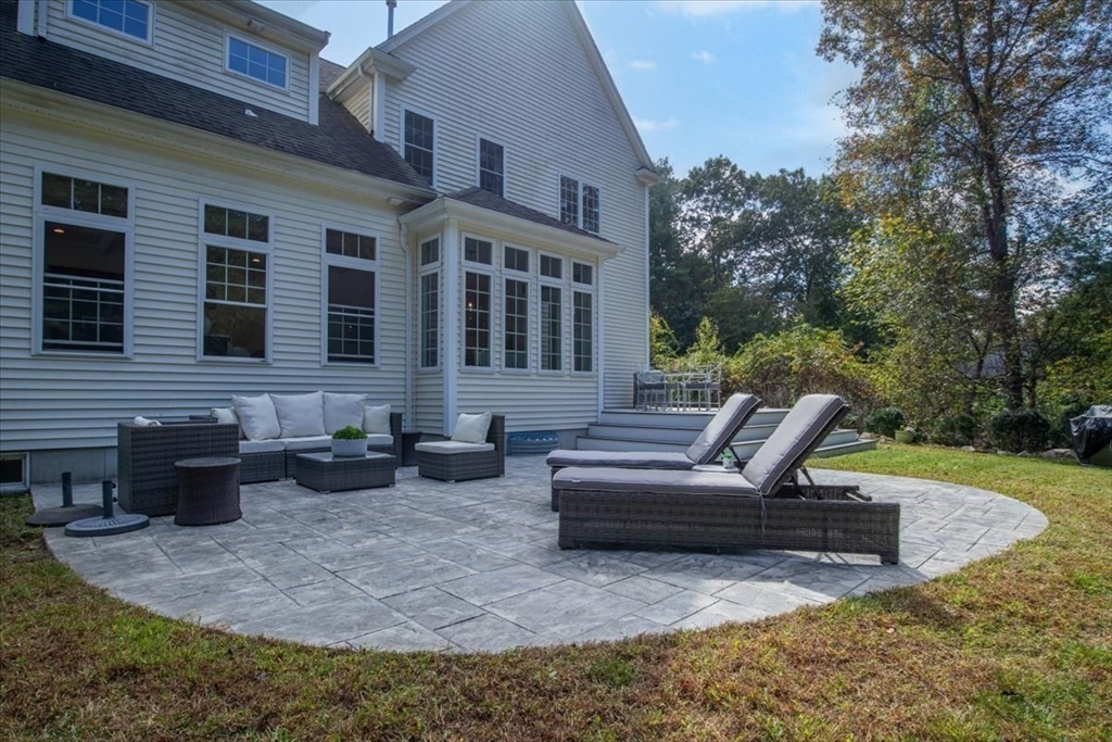55 Cross Street Foxboro, MA 02035 - Photo 5 of 7 a view of a house with patio