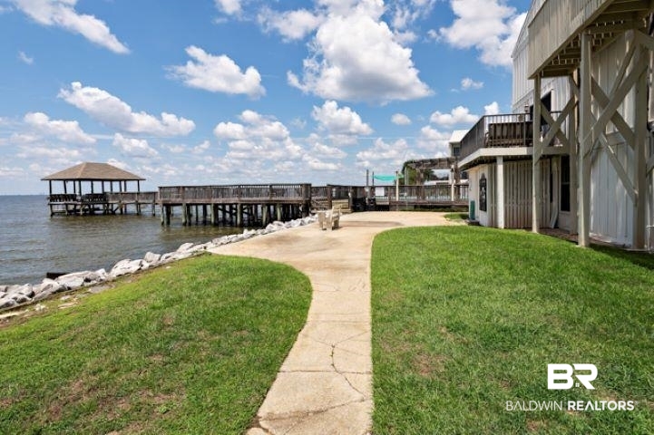 710 South Mobile Street, Unit 52 Fairhope, AL 36532 - Photo 31 of 58 Dock featuring a water view and a lawn