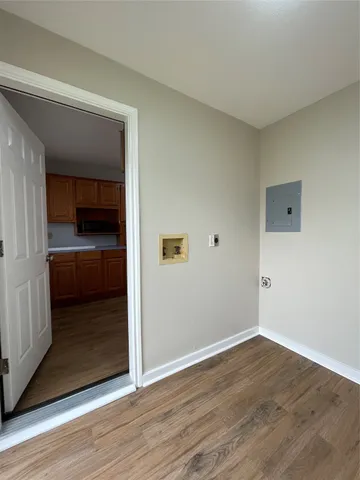 a view of hallway with wooden floor