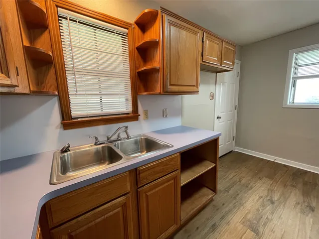 a kitchen that has a sink and a window