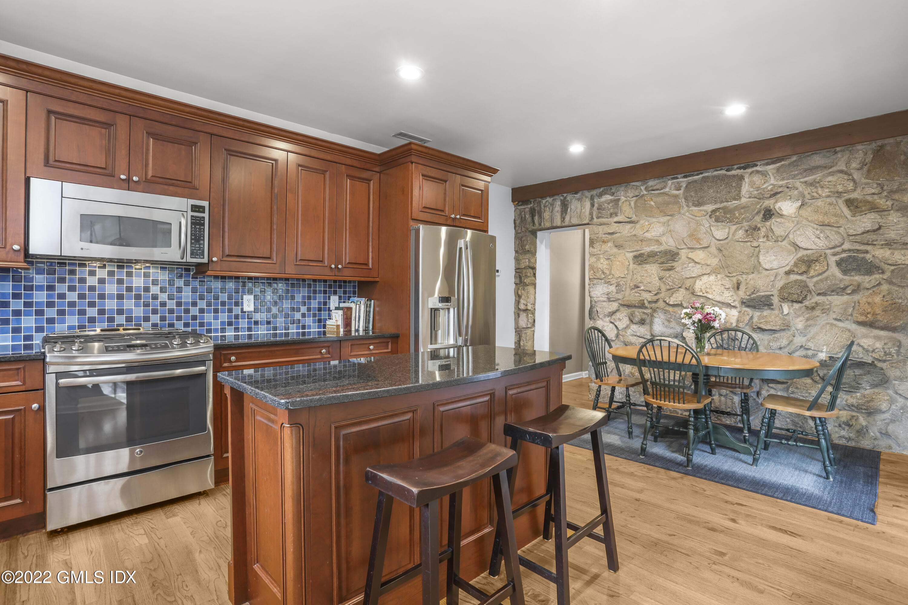 24 Sunshine Avenue Riverside, CT 06878 - Photo 11 of 44 a kitchen with stainless steel appliances granite countertop a stove a sink and a refrigerator