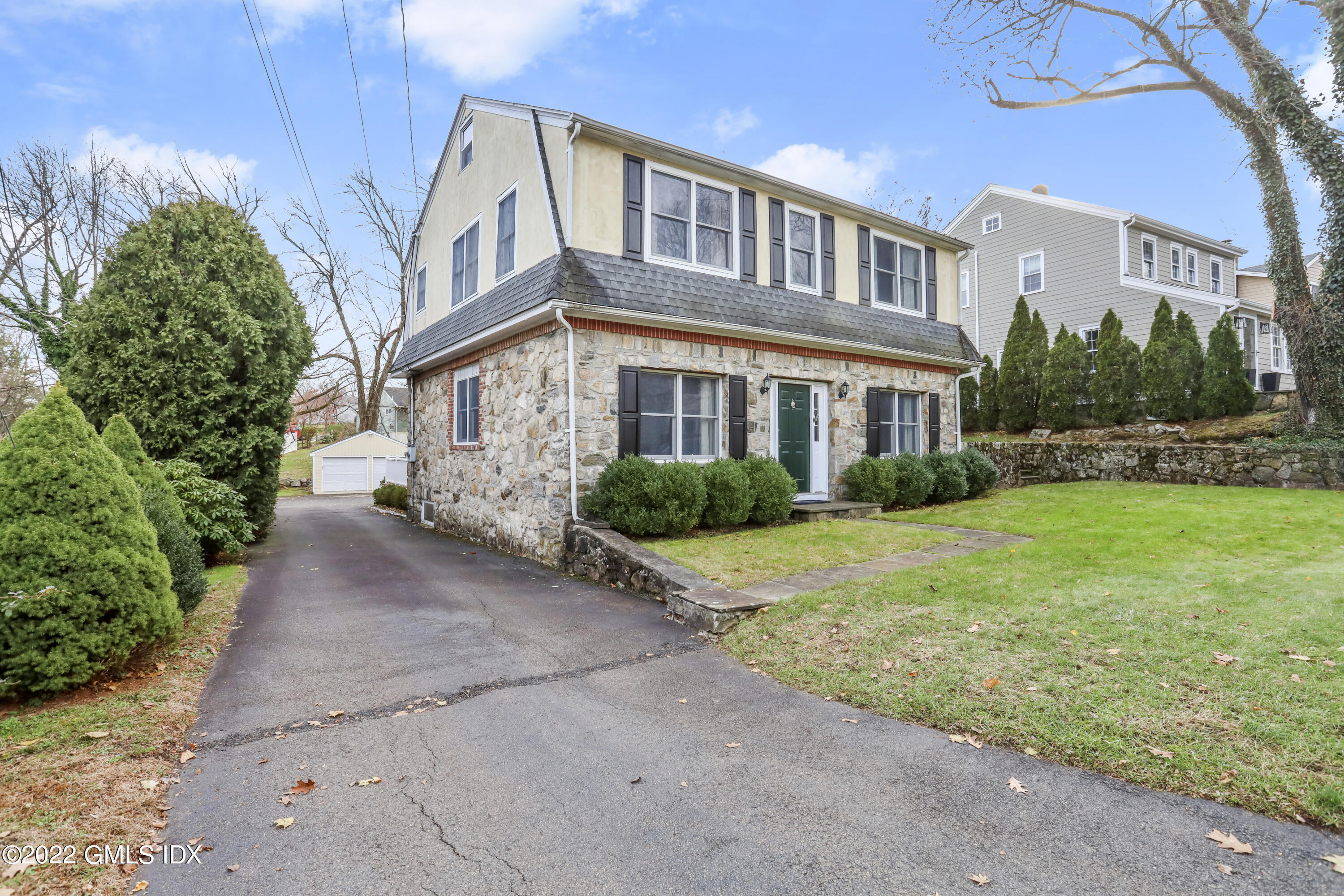 24 Sunshine Avenue Riverside, CT 06878 - Photo 2 of 44 a view of a brick building next to a yard