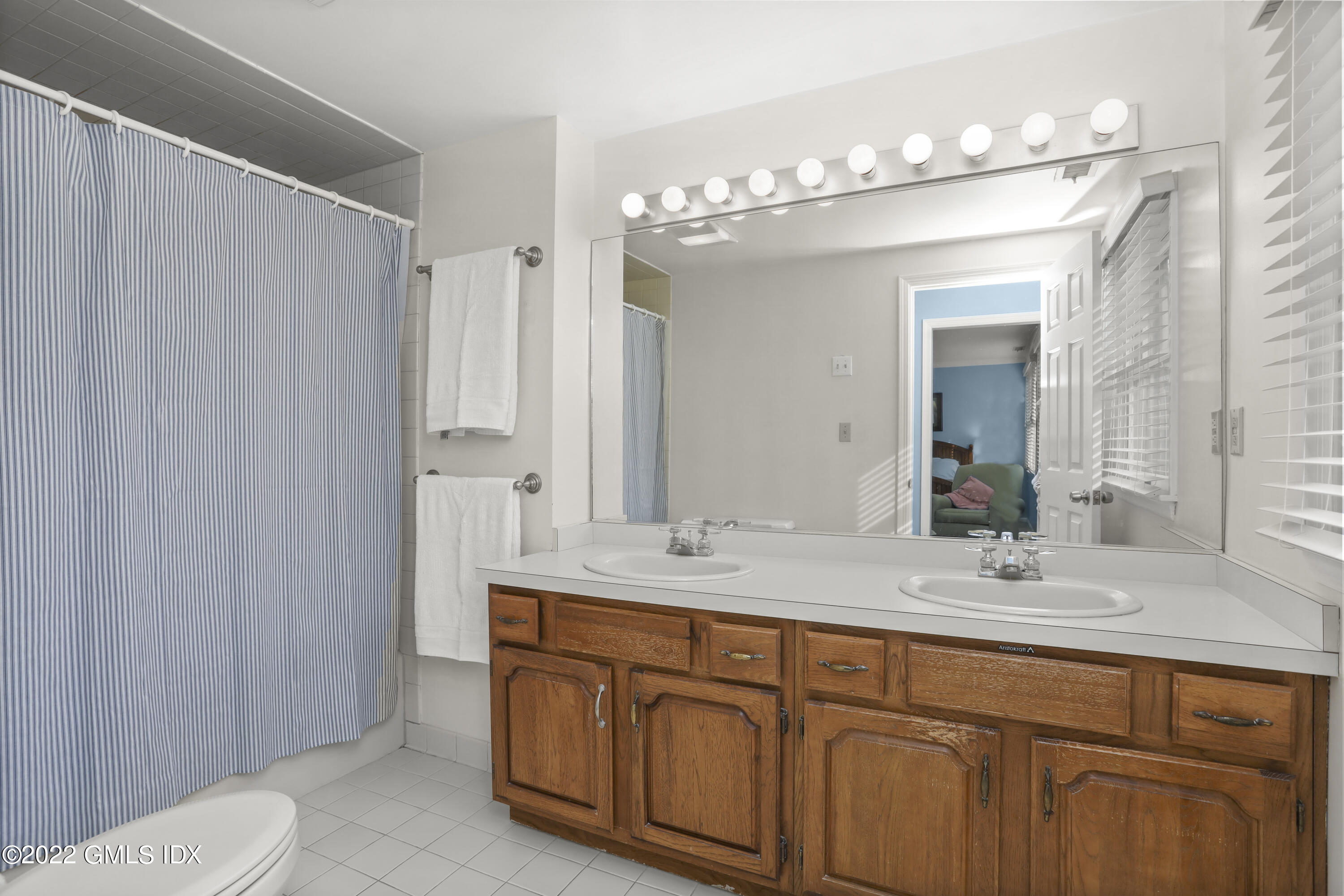 24 Sunshine Avenue Riverside, CT 06878 - Photo 29 of 44 a bathroom with a double vanity sink and a mirror