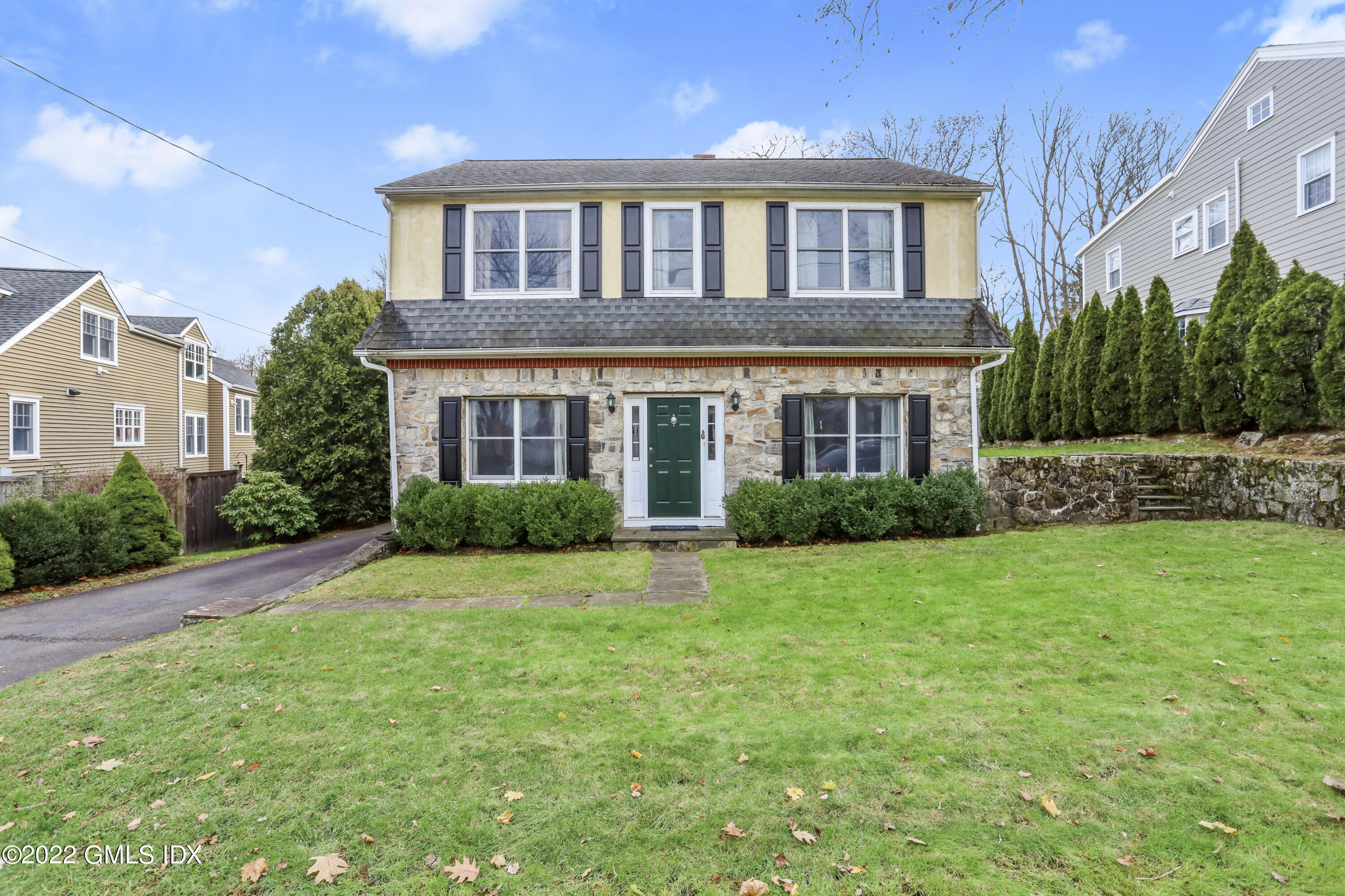 24 Sunshine Avenue Riverside, CT 06878 - Photo 3 of 44 a front view of a house with a yard