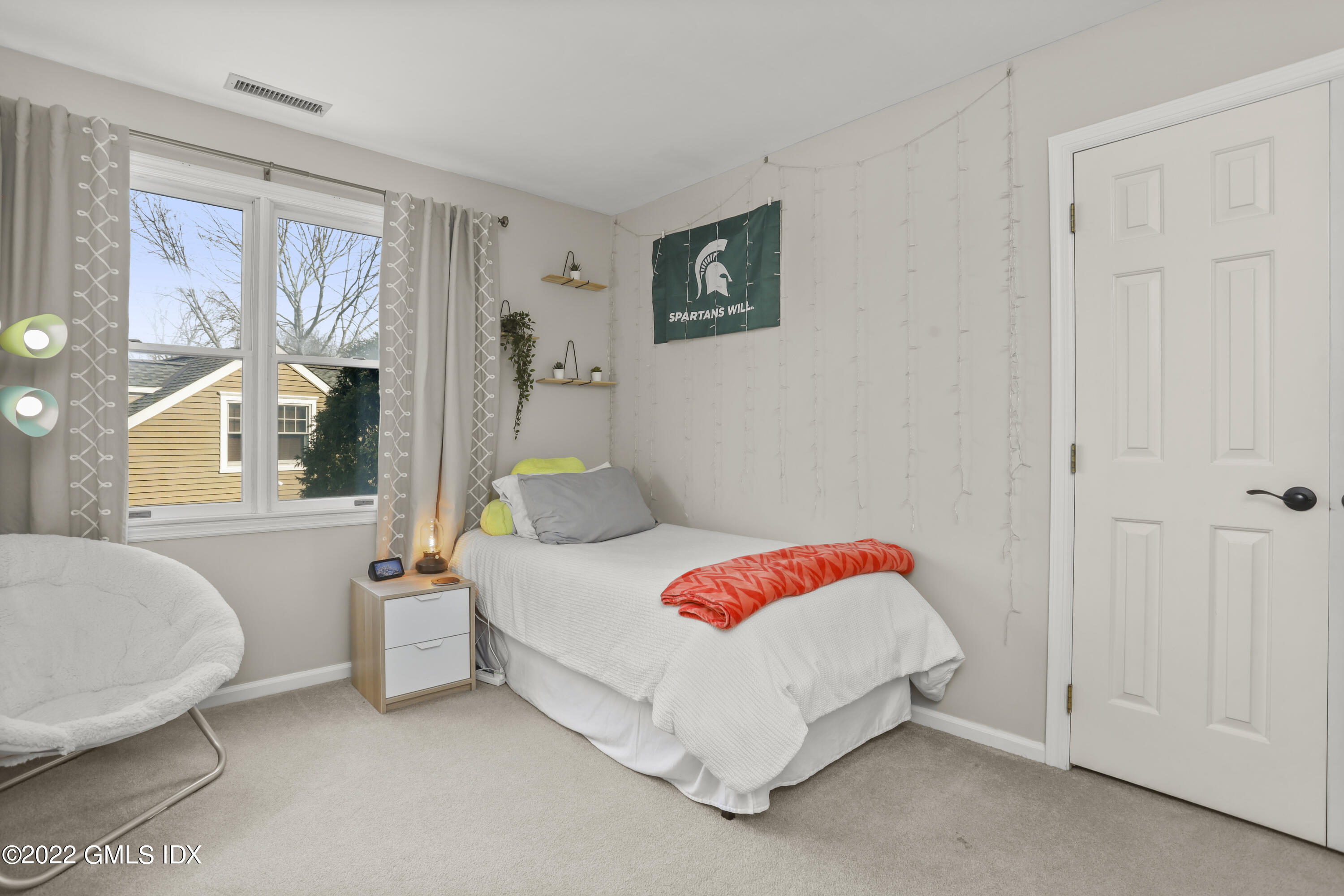 24 Sunshine Avenue Riverside, CT 06878 - Photo 31 of 44 a bedroom with a bed and a large window