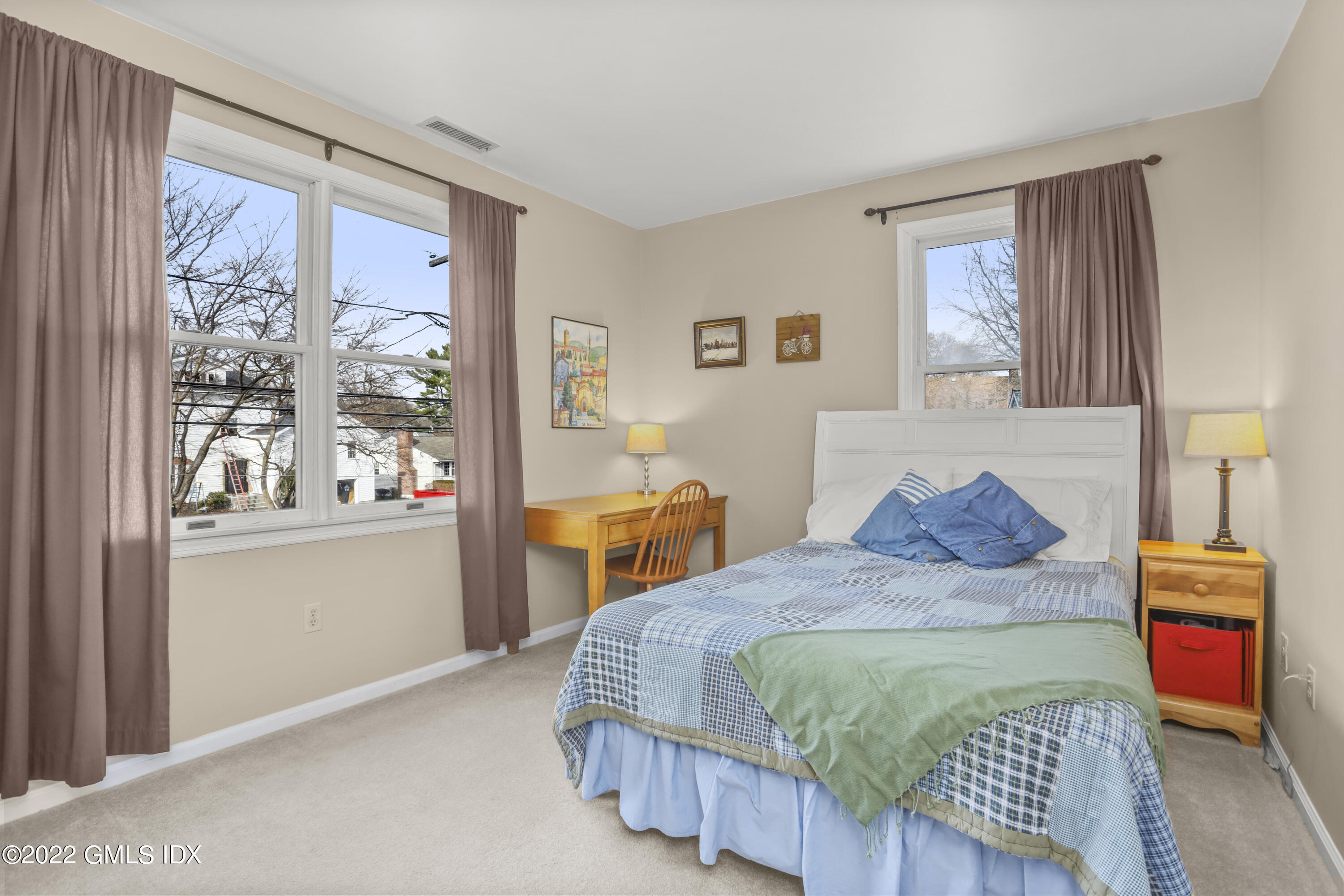 24 Sunshine Avenue Riverside, CT 06878 - Photo 32 of 44 a bedroom with a bed and wooden floor