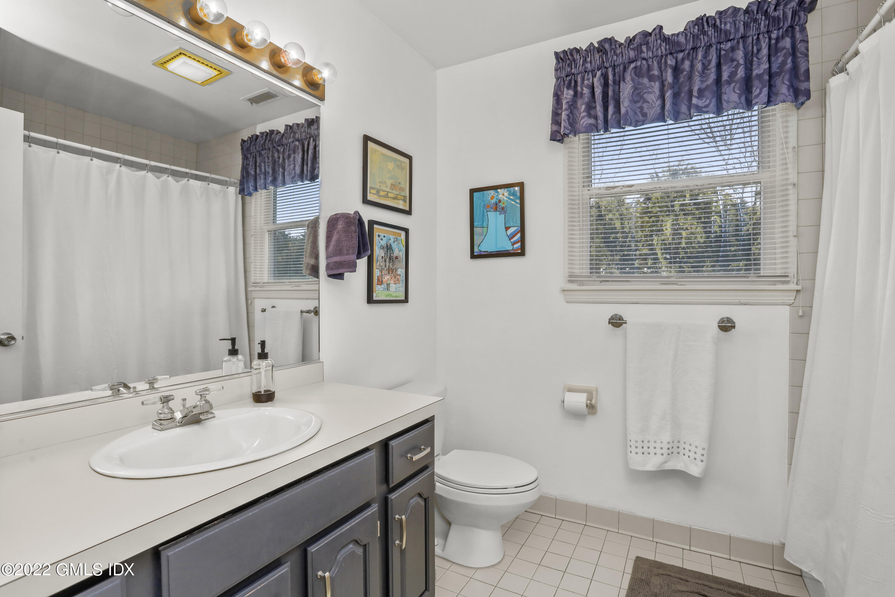 24 Sunshine Avenue Riverside, CT 06878 - Photo 33 of 44 a bathroom with a sink toilet and vanity