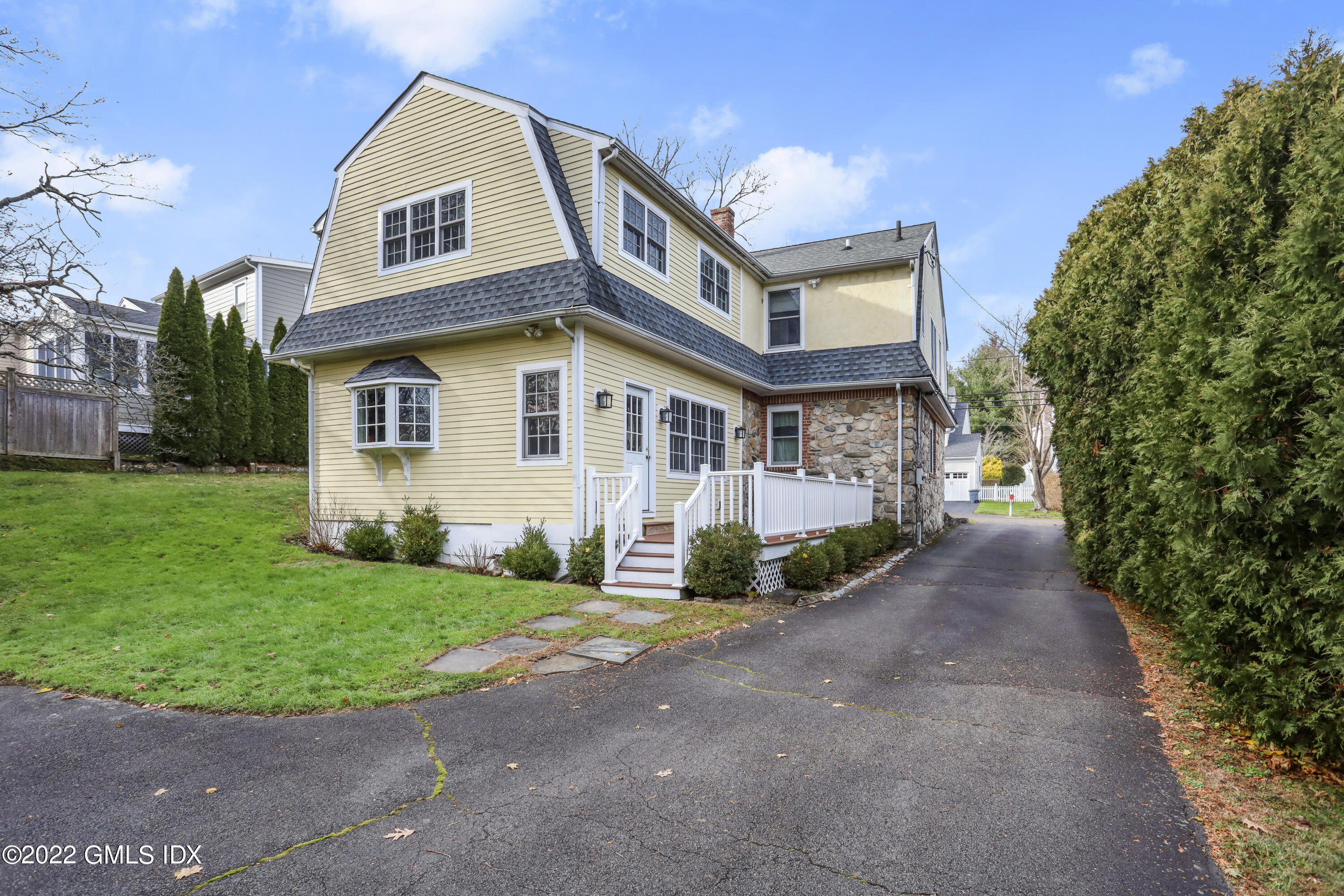 24 Sunshine Avenue Riverside, CT 06878 - Photo 6 of 44 front view of a house with a yard