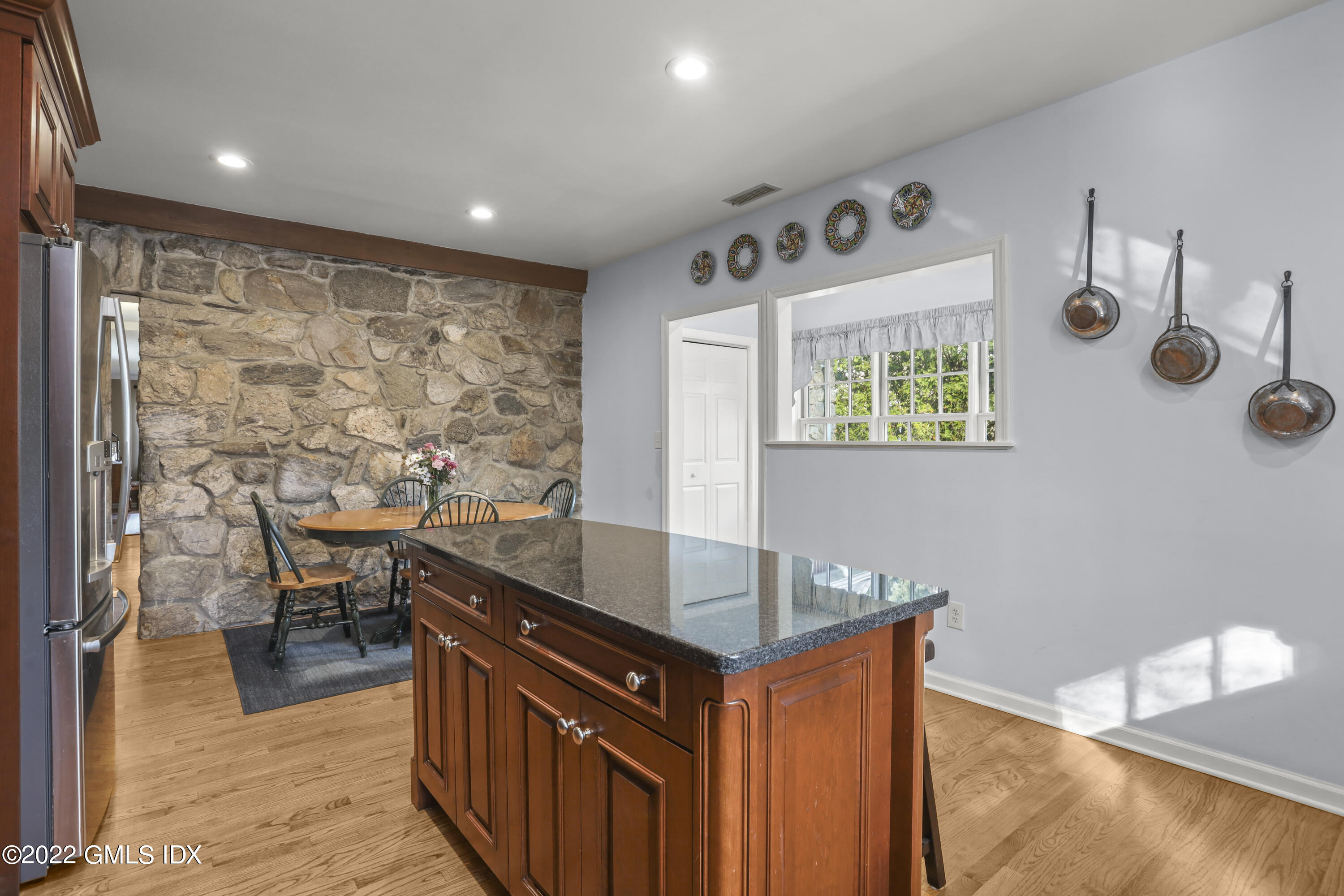 24 Sunshine Avenue Riverside, CT 06878 - Photo 10 of 44 a kitchen with stainless steel appliances granite countertop a sink stove and wooden cabinets