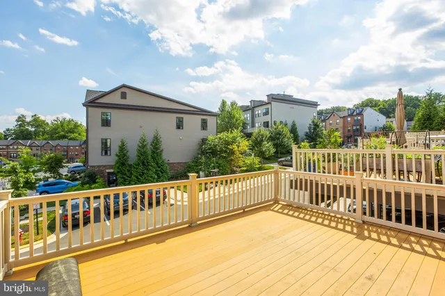 a view of a house with wooden deck