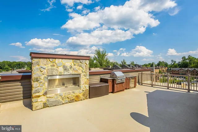 a view of a terrace with swimming pool and furniture