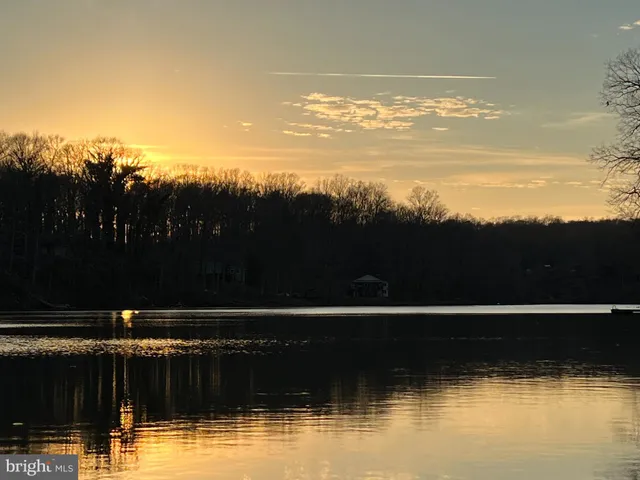 a view of swimming pool with outdoor seating