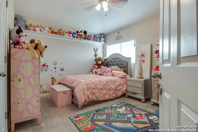 a bedroom with bed and a window