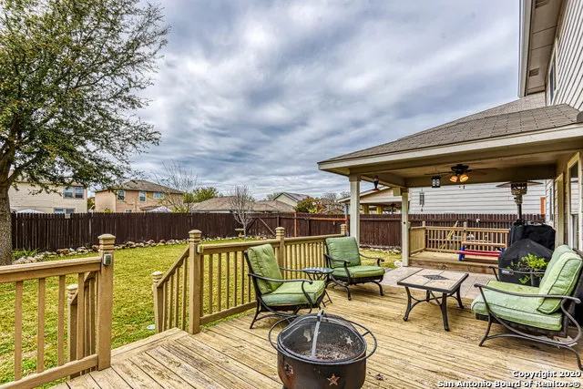an outdoor space with furniture and umbrella