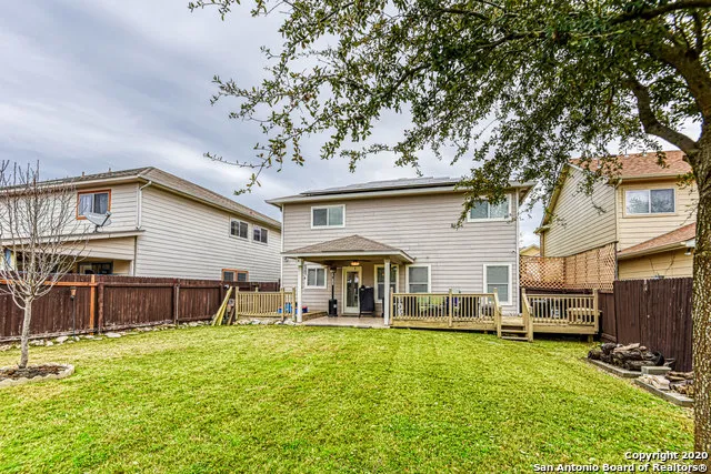 a front view of a house with a yard table and chairs