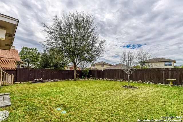 a backyard of a house with lots of green space