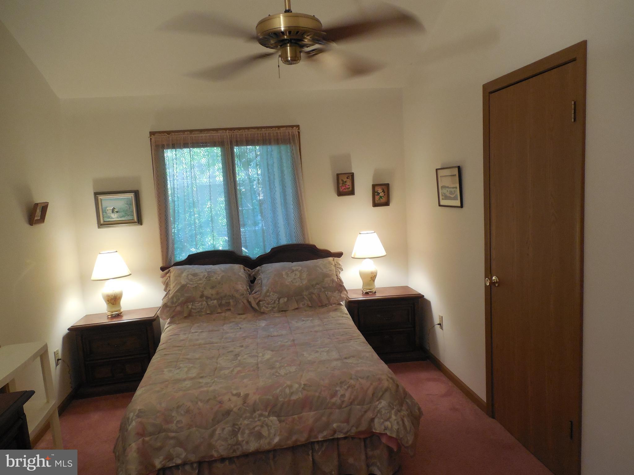 183 Sandyhook Road Ocean Pines, MD 21811 - Photo 14 of 15 a bedroom with a bed and a window