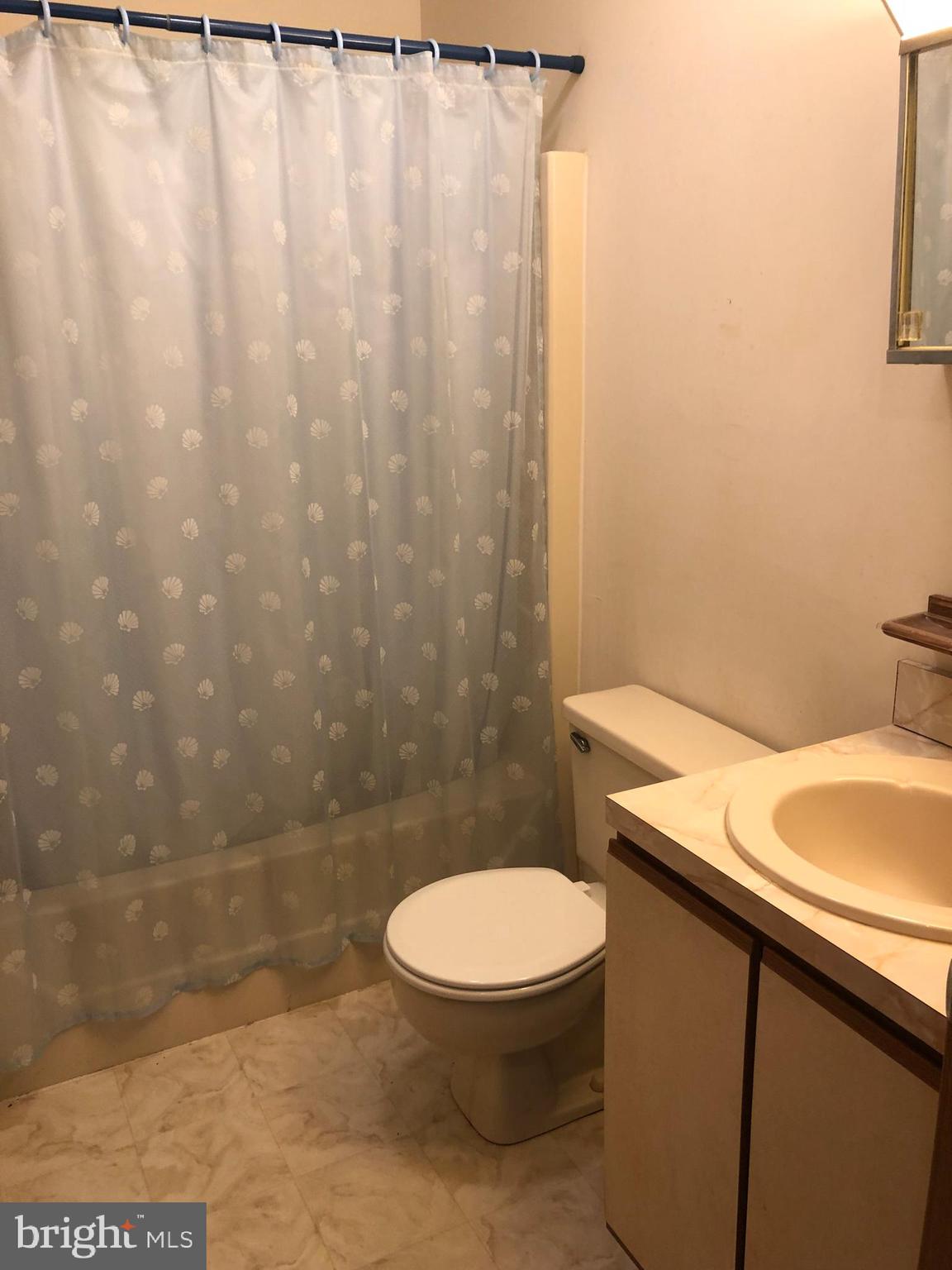 183 Sandyhook Road Ocean Pines, MD 21811 - Photo 15 of 15 a bathroom with a toilet and a sink