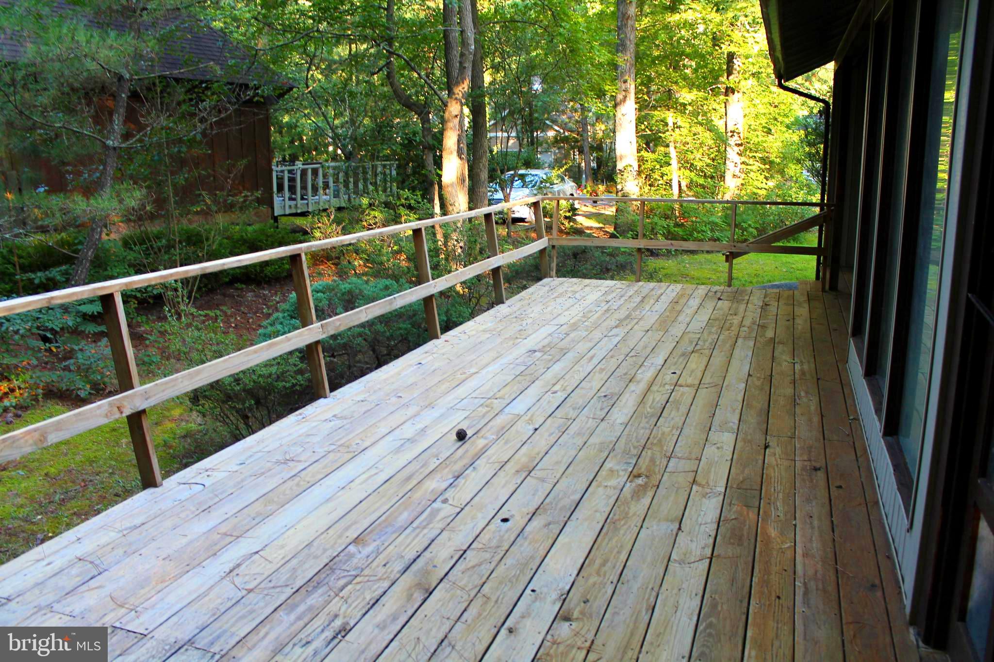 183 Sandyhook Road Ocean Pines, MD 21811 - Photo 3 of 15 a view of balcony with wooden floor and fence
