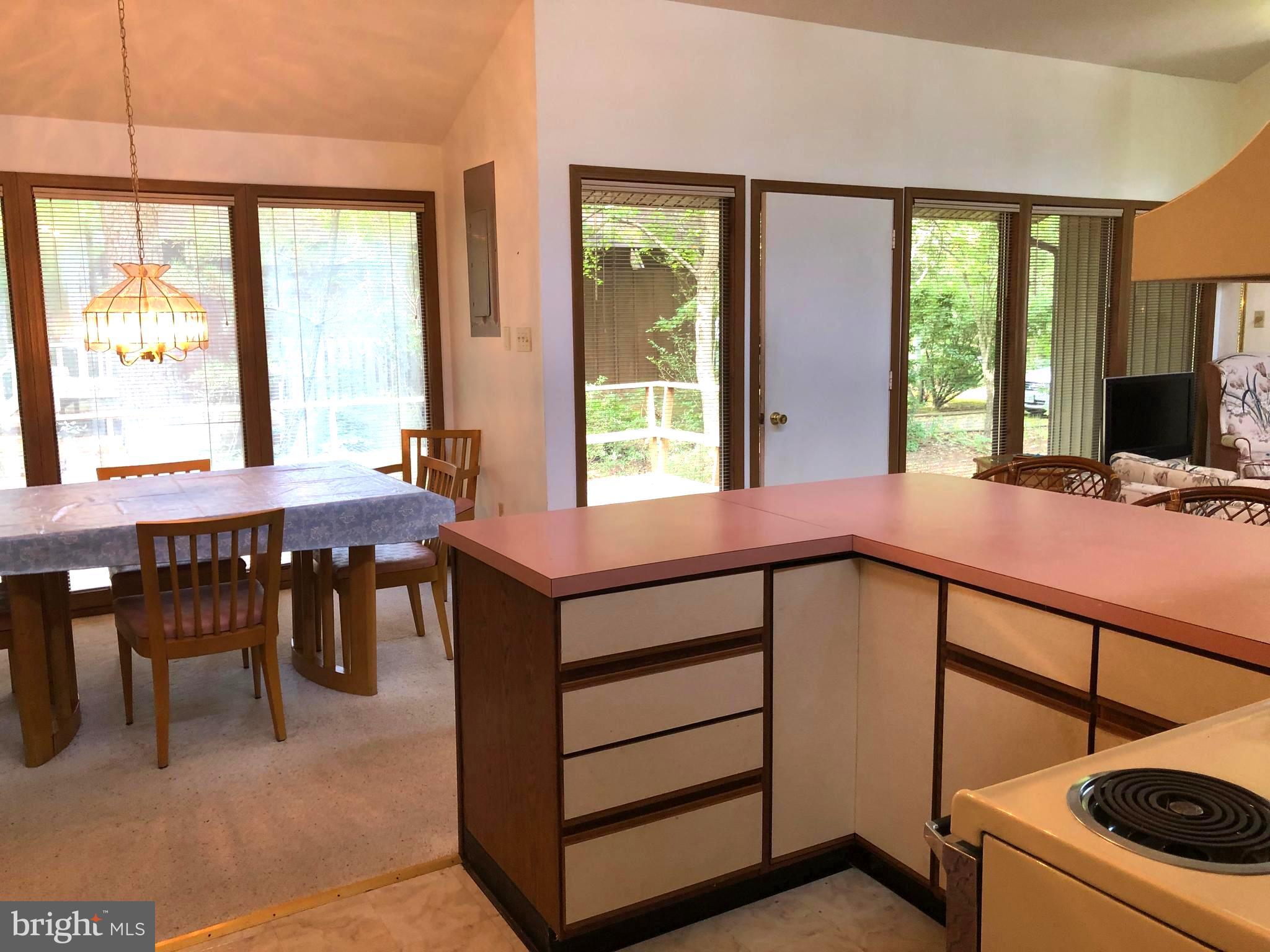 183 Sandyhook Road Ocean Pines, MD 21811 - Photo 6 of 15 a view of a dining room with furniture window and outside view