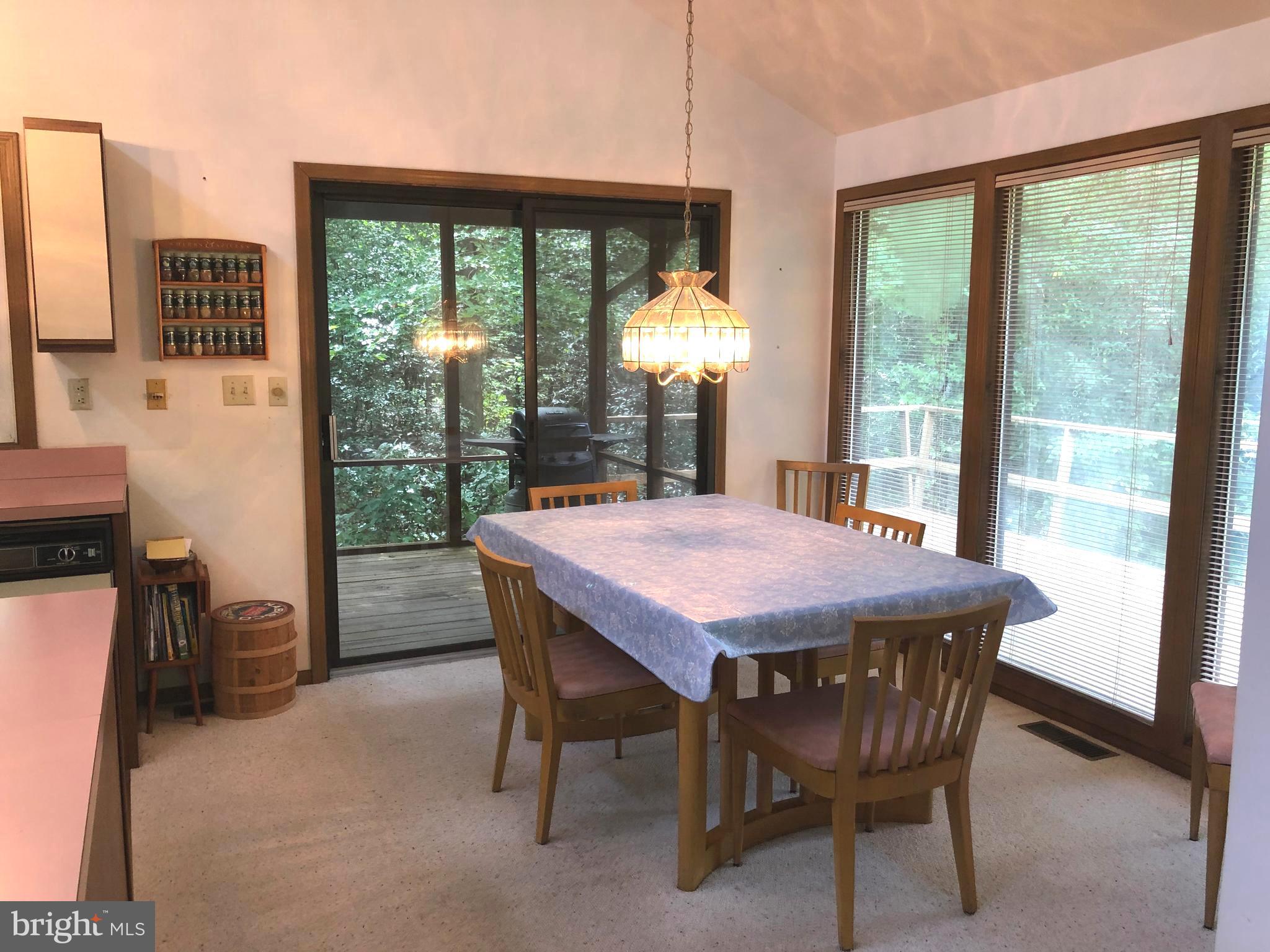 183 Sandyhook Road Ocean Pines, MD 21811 - Photo 7 of 15 a dining room with furniture and a floor to ceiling window