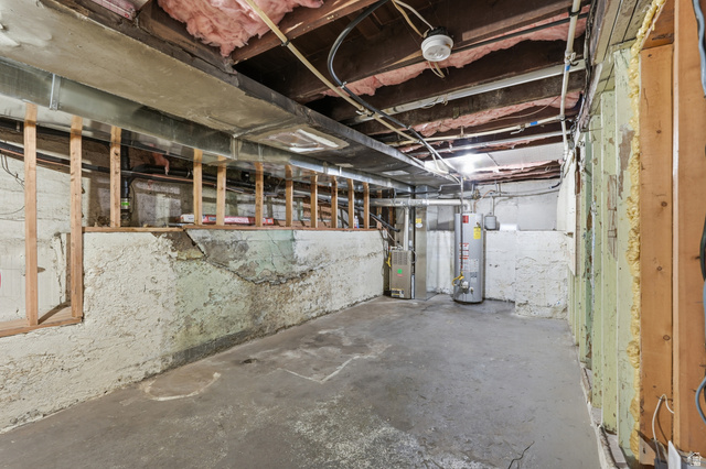 215 East 300 South Logan, UT 84321 - Photo 22 of 32 Unfinished below grade area with heating unit and gas water heater