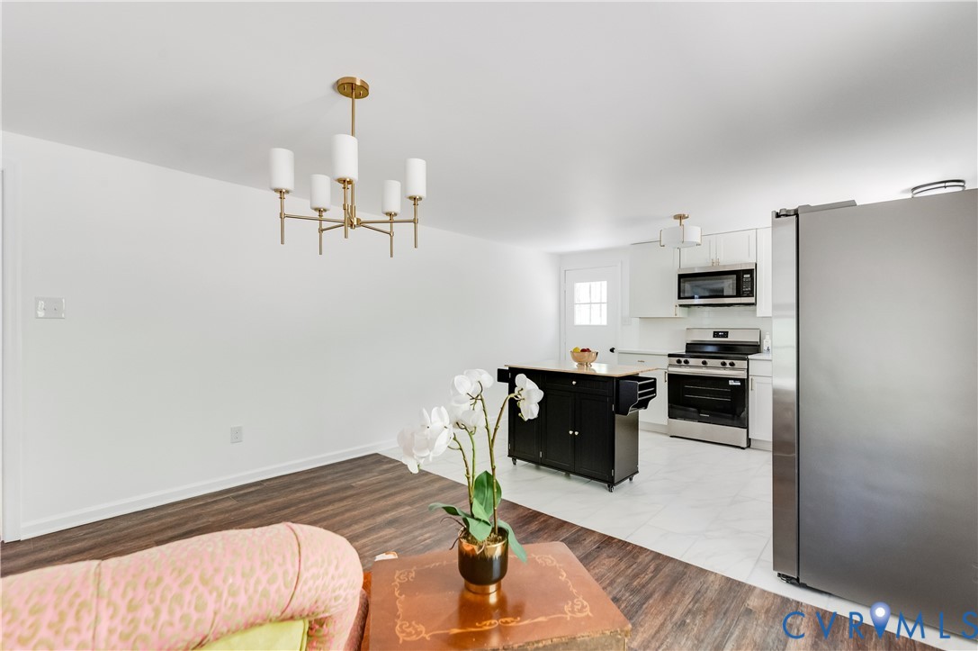 26 Liberty Tree Lane Hanover, VA 23069 - Photo 16 of 38 a kitchen with a refrigerator and a stove top oven