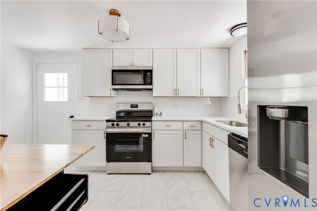 26 Liberty Tree Lane Hanover, VA 23069 - Photo 17 of 38 a kitchen with cabinets stainless steel appliances and a counter space
