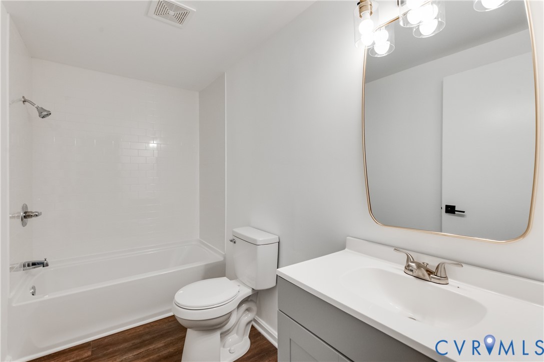 26 Liberty Tree Lane Hanover, VA 23069 - Photo 24 of 38 a bathroom with a sink a toilet and shower