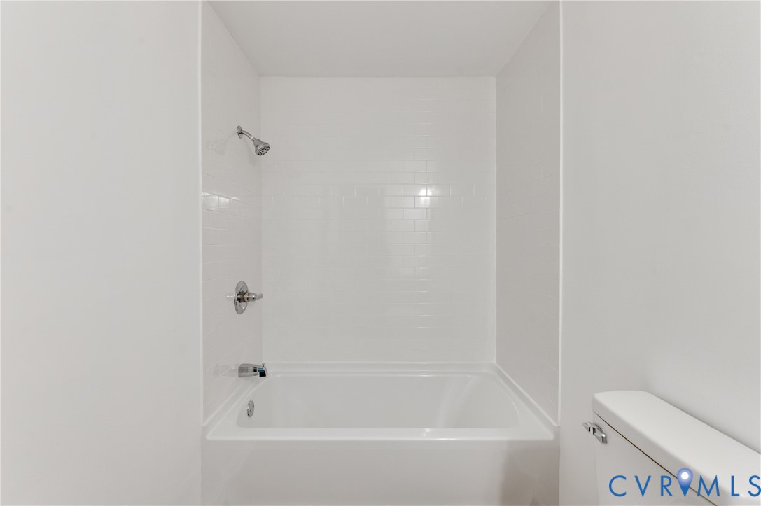 26 Liberty Tree Lane Hanover, VA 23069 - Photo 25 of 38 a white bath tub sitting next to a white toilet
