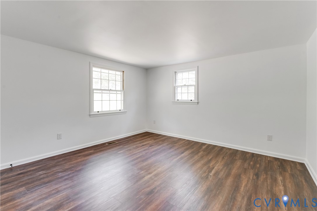 26 Liberty Tree Lane Hanover, VA 23069 - Photo 28 of 38 an empty room with wooden floor and windows