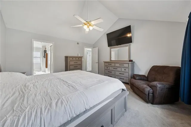 a view of a hallway with a livingroom and entryway