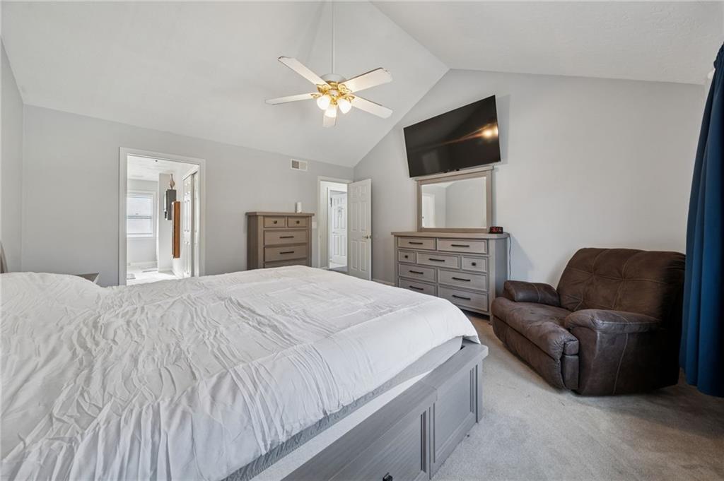 227 Sandworks Road Hunker, PA 15639 - Photo 19 of 41 a spacious bedroom with a bed and a flat screen tv