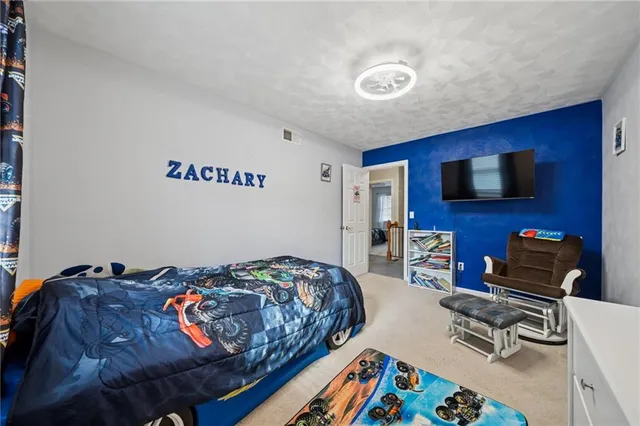 a bedroom with a bed and furniture