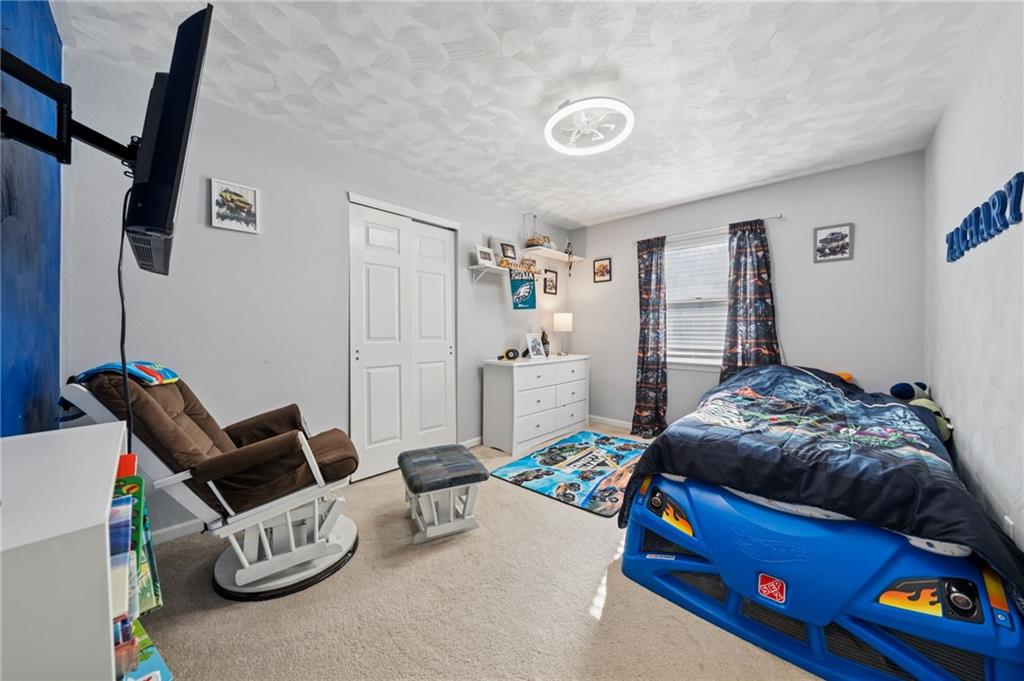 227 Sandworks Road Hunker, PA 15639 - Photo 26 of 41 a bedroom with a bed and furniture