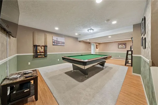 a view of a livingroom with furniture and a flat screen tv