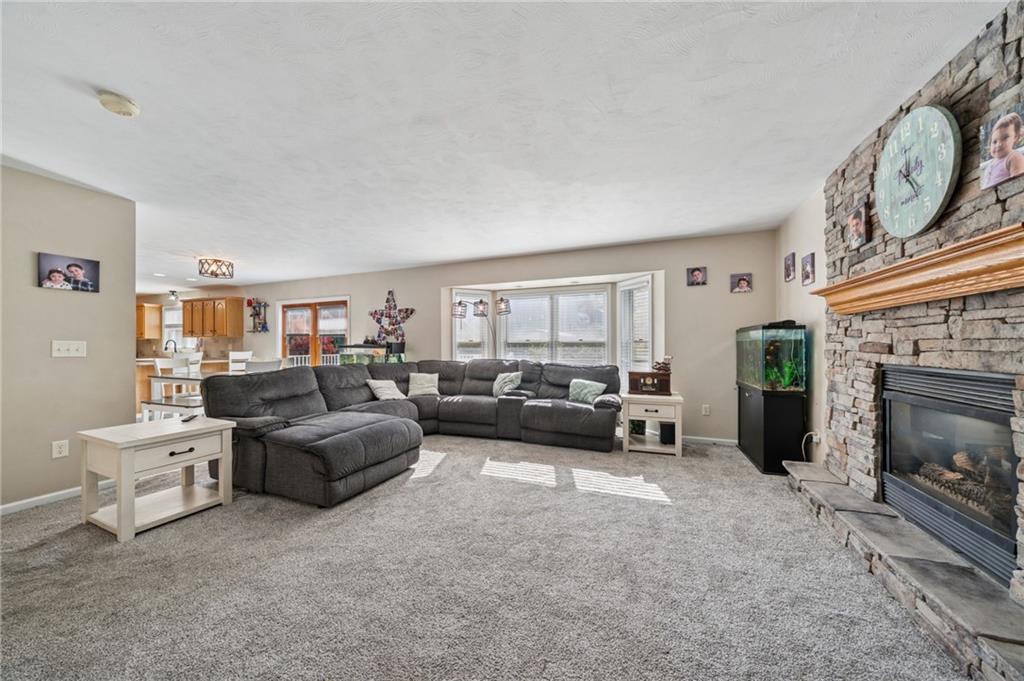 227 Sandworks Road Hunker, PA 15639 - Photo 5 of 41 a living room with furniture and a fireplace