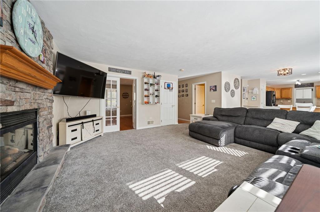 227 Sandworks Road Hunker, PA 15639 - Photo 6 of 41 a living room with furniture and a flat screen tv