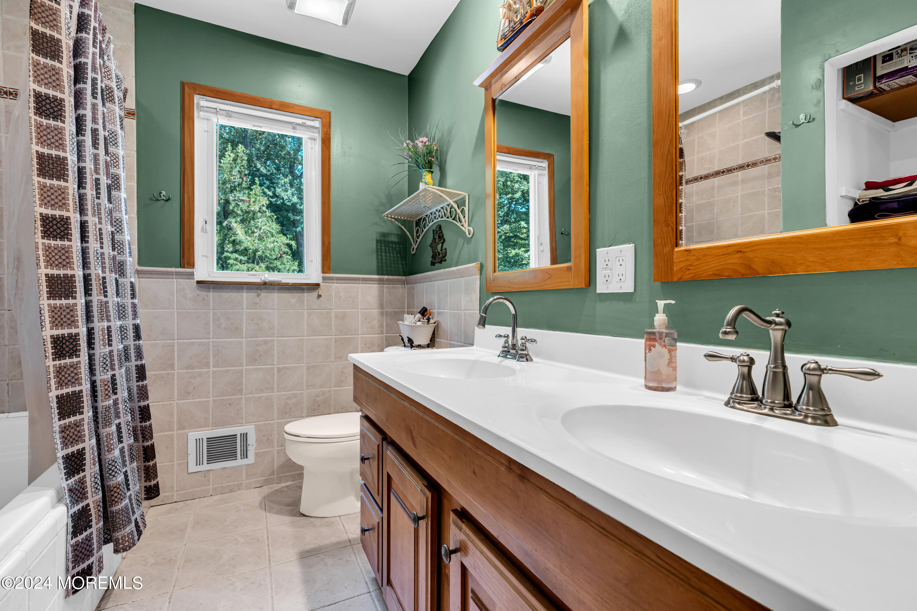 6 Pepperridge Road Howell, NJ 07731 - Photo 24 of 44 a bathroom with a sink and a mirror