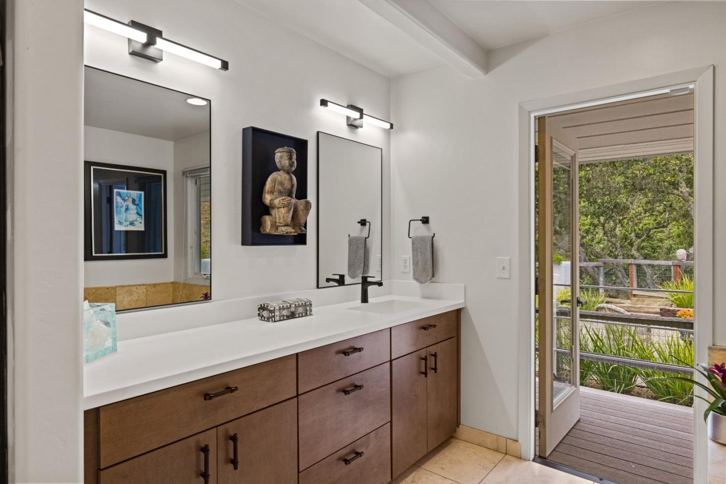 27 La Rancheria Carmel Valley, CA 93924 - Photo 15 of 30 a bathroom with a double vanity sink and a mirror