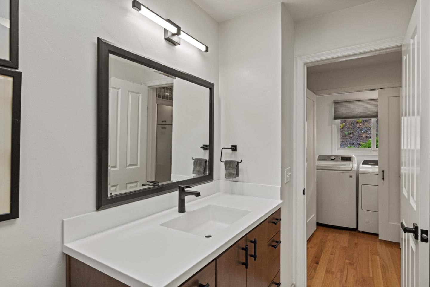 27 La Rancheria Carmel Valley, CA 93924 - Photo 17 of 30 a bathroom with a sink and a mirror